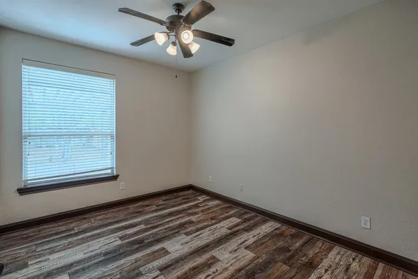 a view of an empty room and closet area