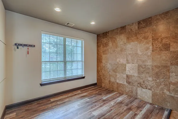 a view of kitchen with furniture and wooden floor