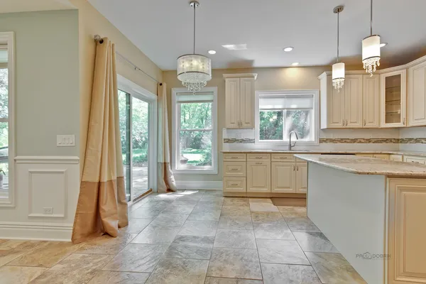 a large bathroom with a large tub and sink