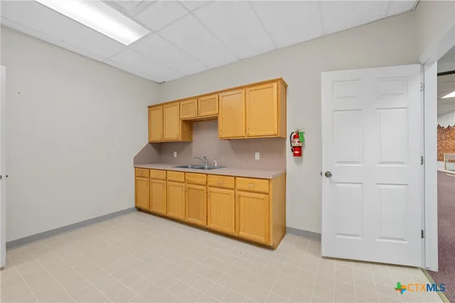 a kitchen with stainless steel appliances granite countertop a sink and cabinets