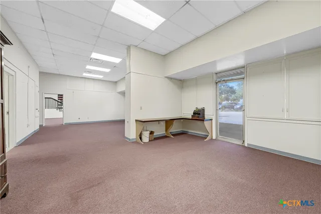 a view of an empty room with a closet