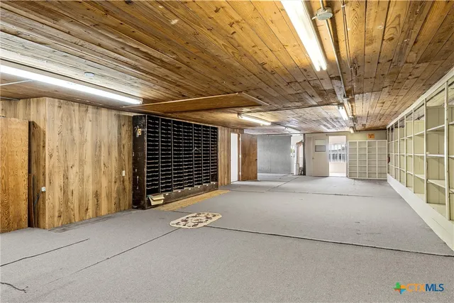 a view of a room with stairs and a wooden floor