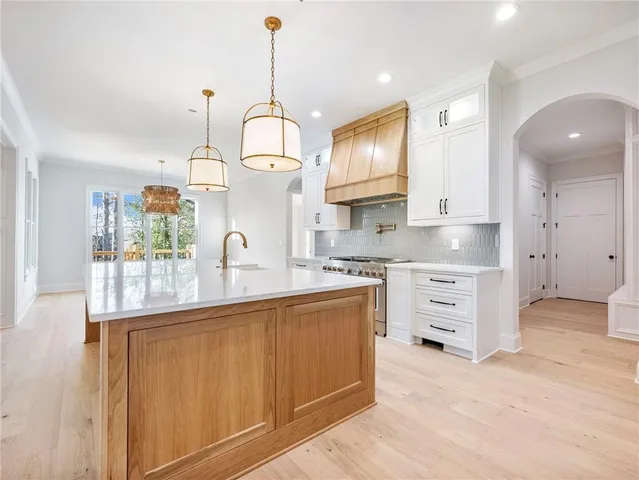 a view of a room with wooden floor window and a ceiling fan