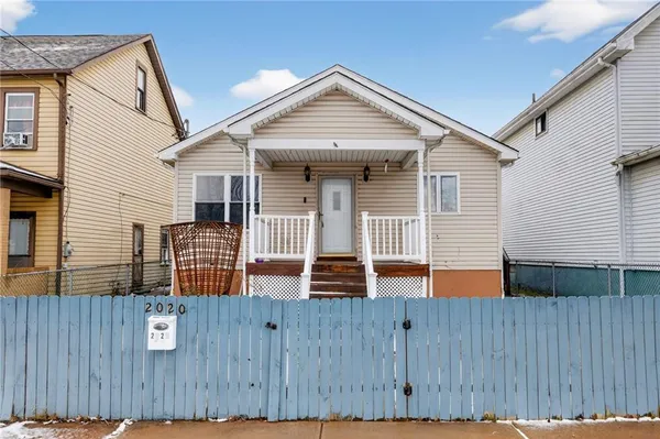 a front view of a house with glass windows