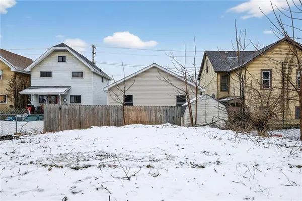a view of a house covered in snow