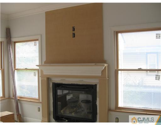 877 Englishtown Road Old Bridge, NJ 08857 - Photo 5 of 8 a close view of a fireplace