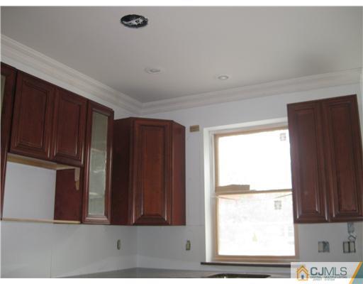877 Englishtown Road Old Bridge, NJ 08857 - Photo 6 of 8 a view of kitchen with wooden floor