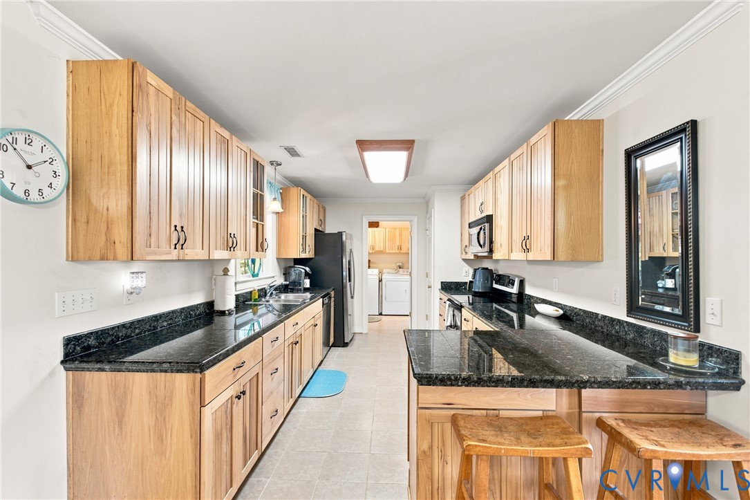 197 Goshen Road Cumberland, VA 23040 - Photo 5 of 70 Galley kitchen featuring light wood cabinetry, dar