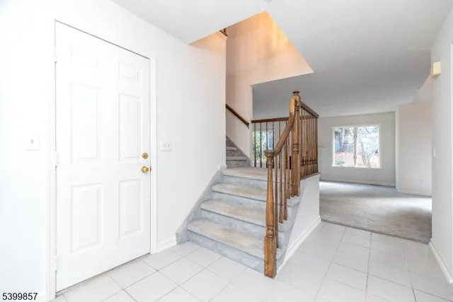 a view of entryway and hall with a front door