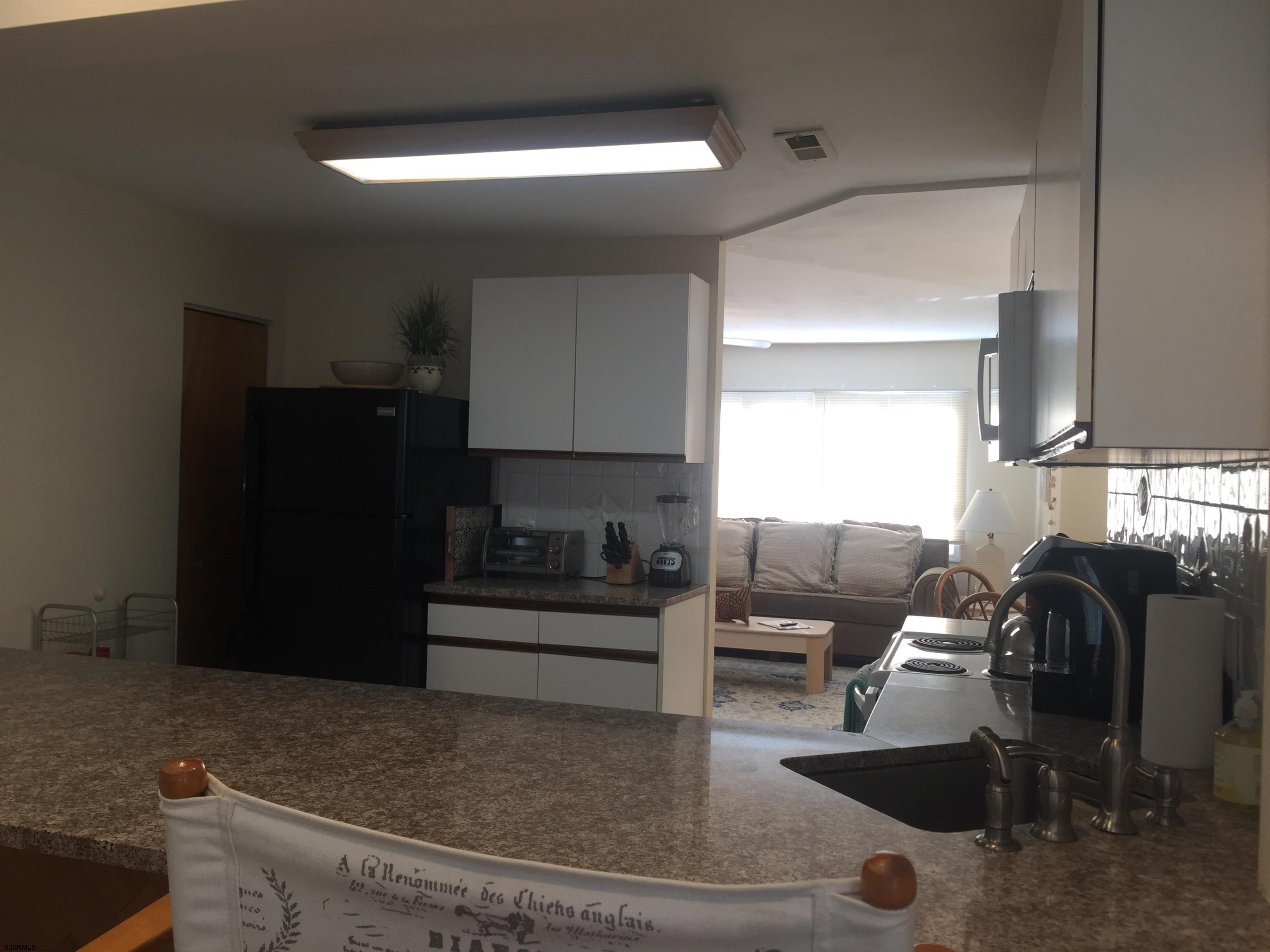 4013 West Brigantine Avenue, Unit 1 Brigantine, NJ 08203 - Photo 12 of 33 a living room with furniture and a air conditioner vent