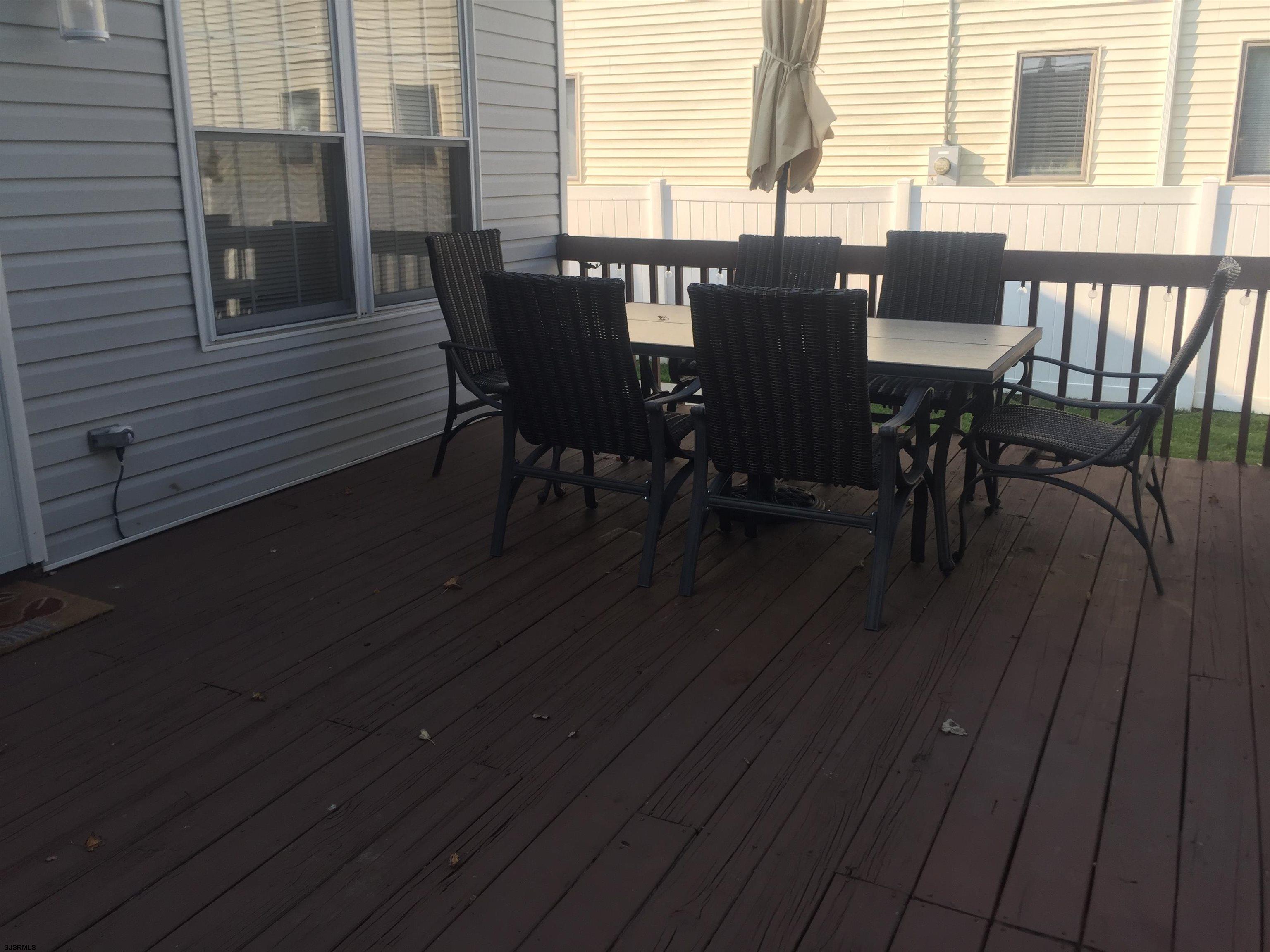 4013 West Brigantine Avenue, Unit 1 Brigantine, NJ 08203 - Photo 23 of 33 a view of a dining room with furniture and wooden floor