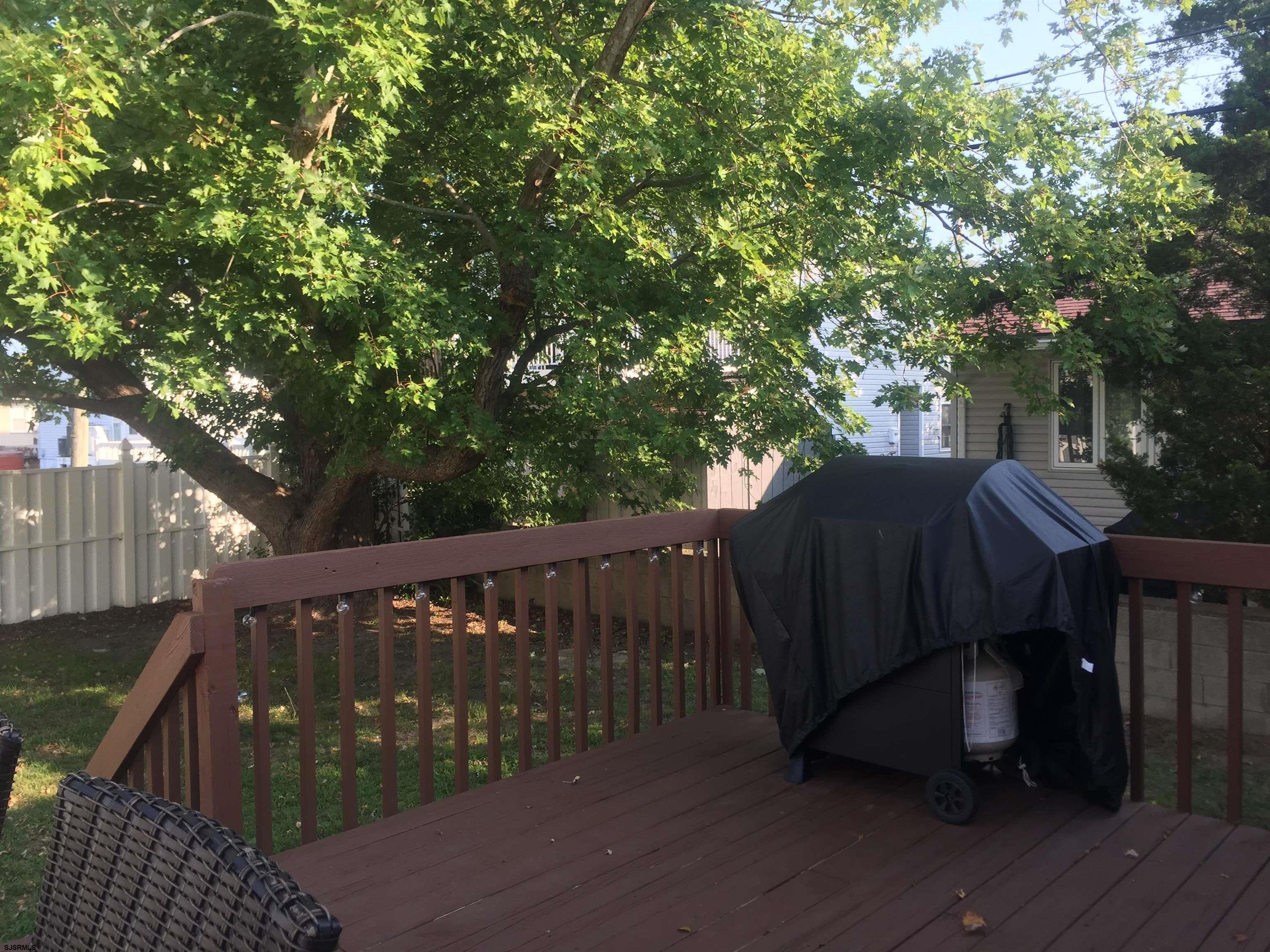 4013 West Brigantine Avenue, Unit 1 Brigantine, NJ 08203 - Photo 24 of 33 a view of deck with furniture and trees