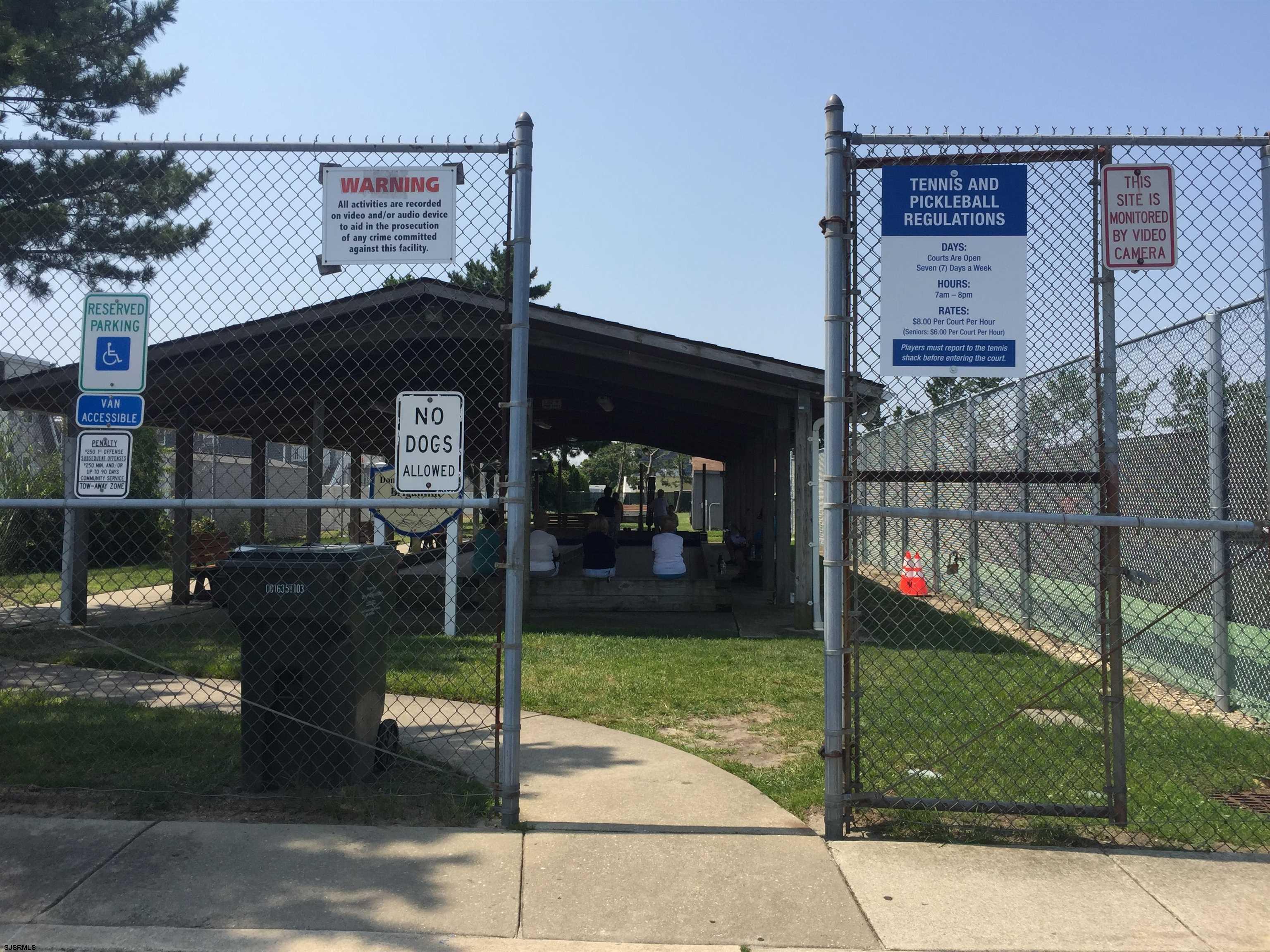 4013 West Brigantine Avenue, Unit 1 Brigantine, NJ 08203 - Photo 30 of 33 a view of a chairs and table in the backyard