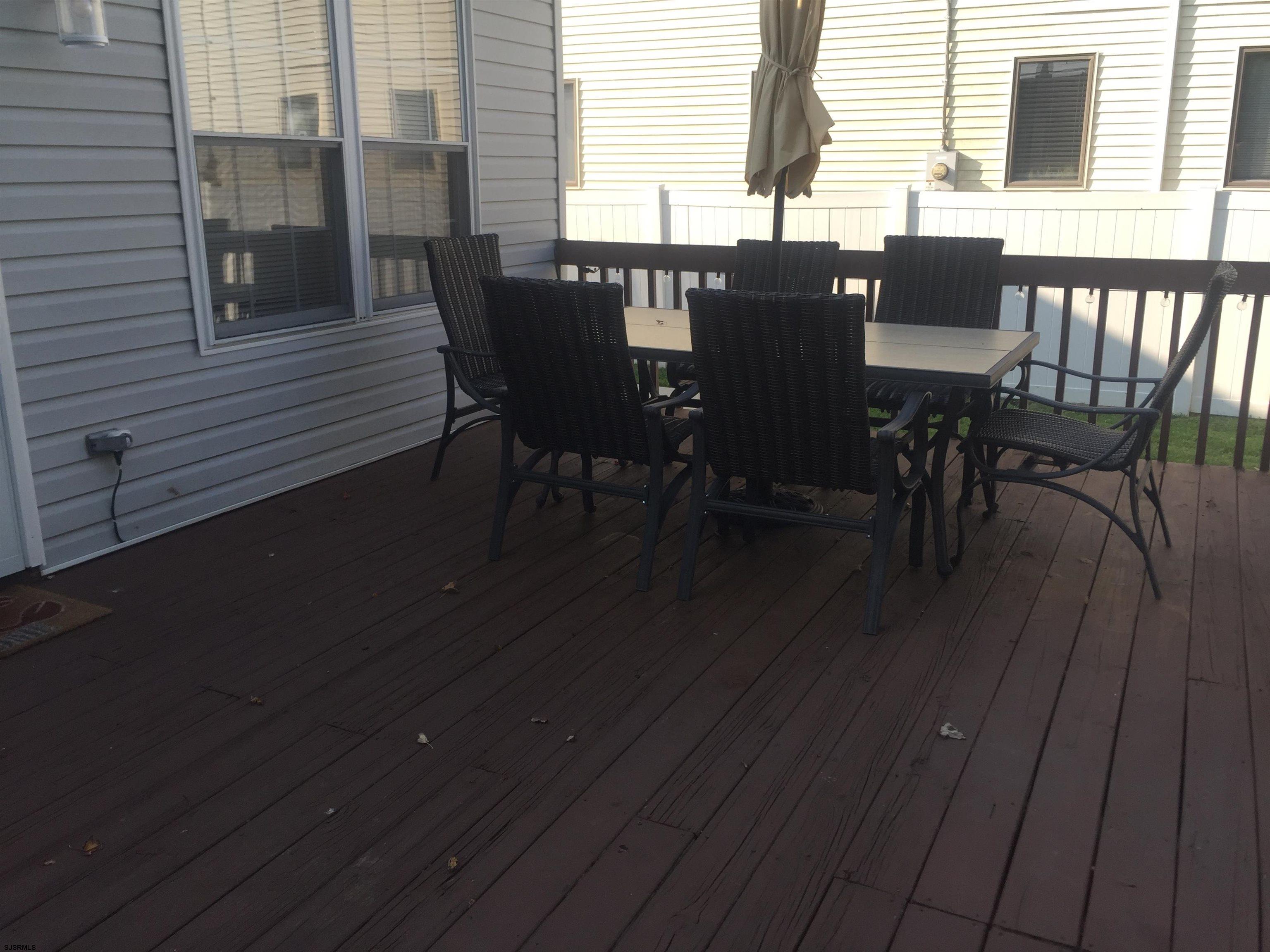 4013 West Brigantine Avenue, Unit 1 Brigantine, NJ 08203 - Photo 4 of 33 a view of a dining room with furniture and wooden floor