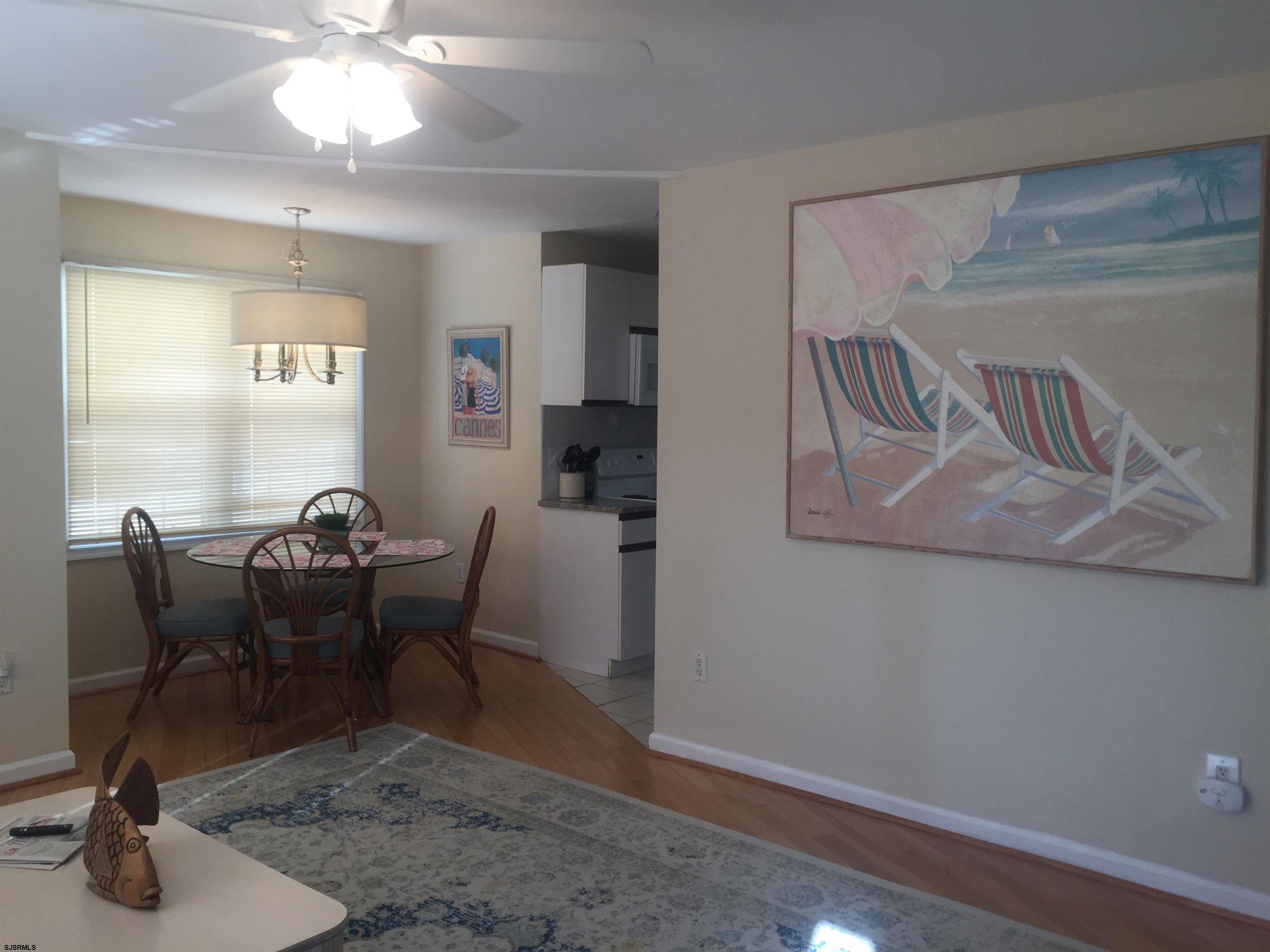 4013 West Brigantine Avenue, Unit 1 Brigantine, NJ 08203 - Photo 9 of 33 a view of a dining room with furniture