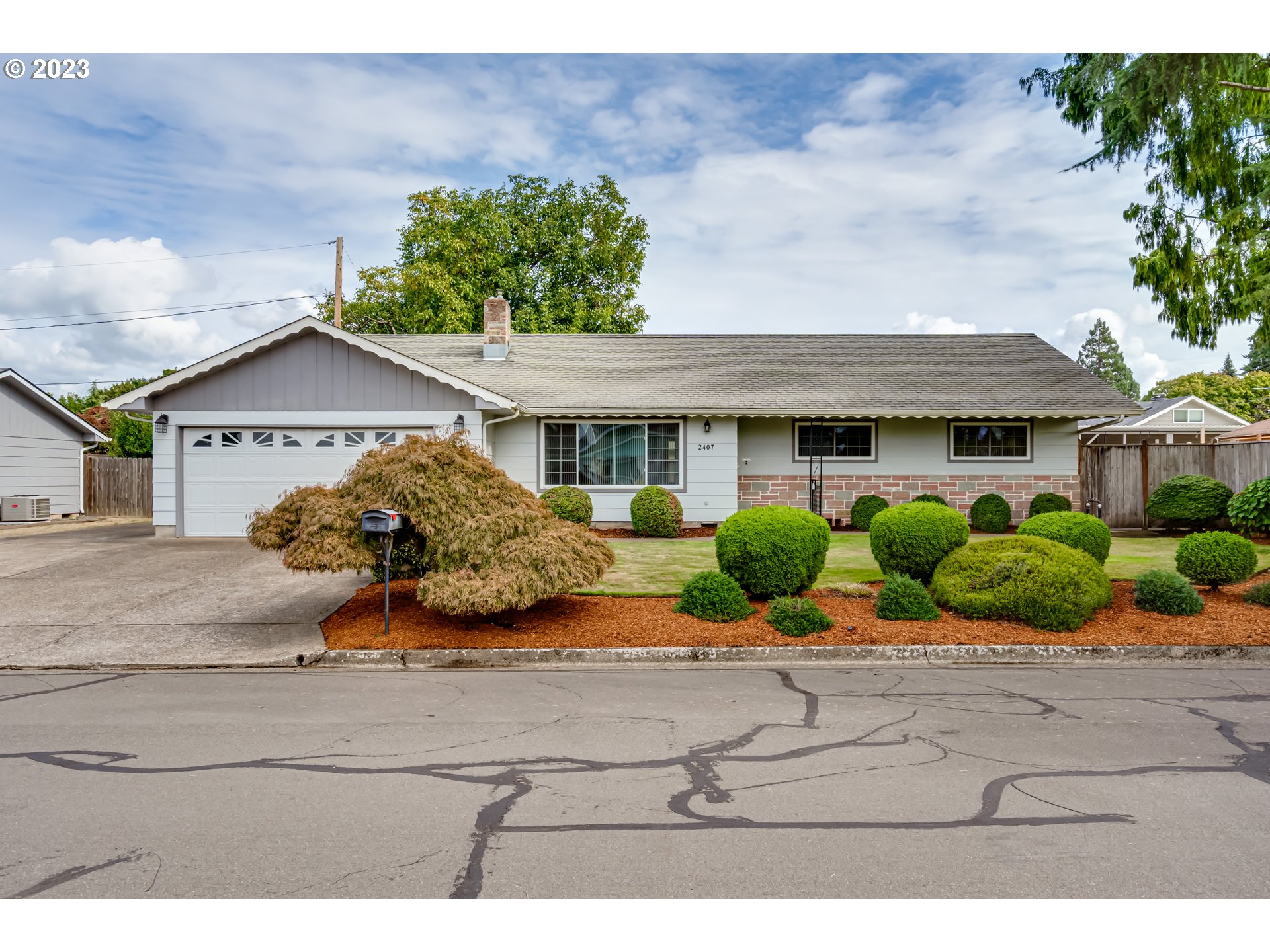 2407 17th Street Springfield, OR 97477 - Photo 1 of 40 a front view of a house with garden
