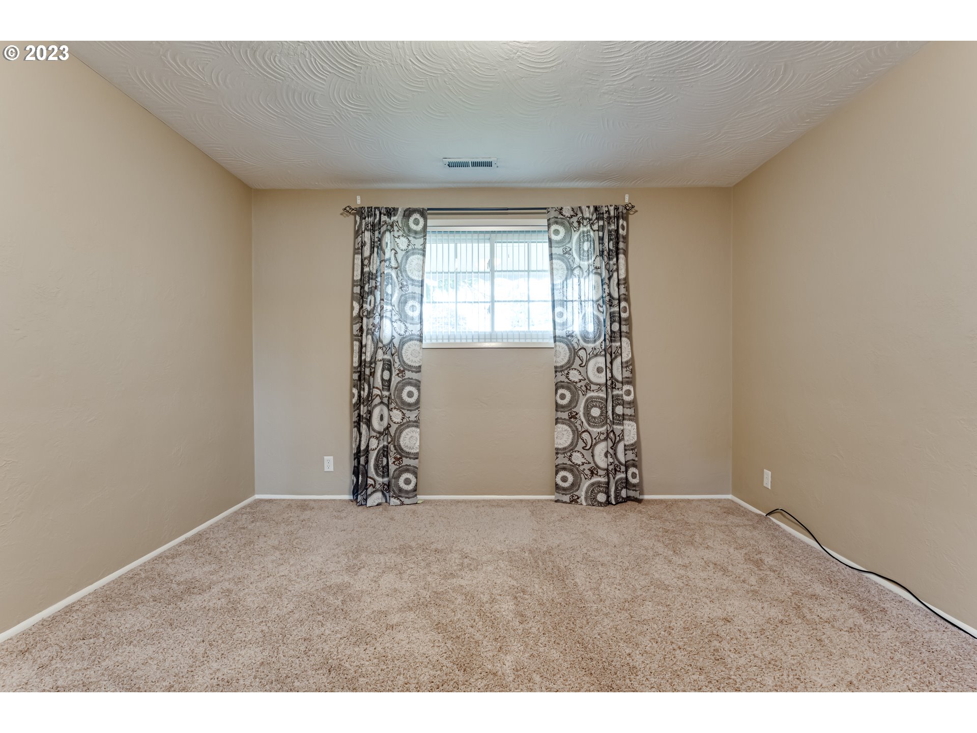 2407 17th Street Springfield, OR 97477 - Photo 11 of 40 a view of an empty room with a window