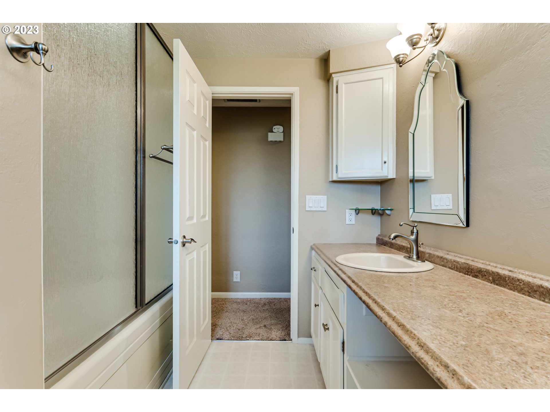 2407 17th Street Springfield, OR 97477 - Photo 13 of 40 a bathroom with a sink and a mirror