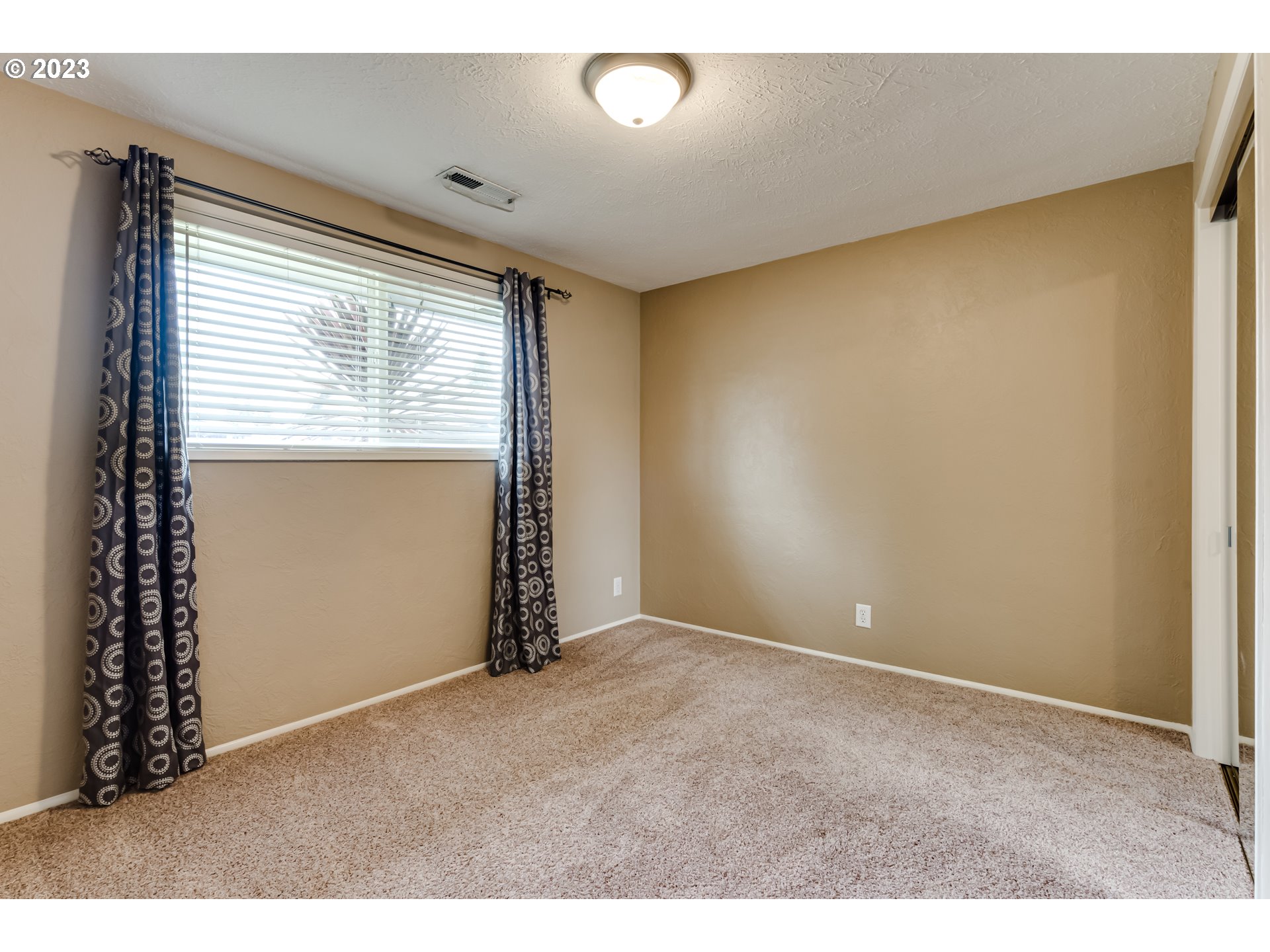 2407 17th Street Springfield, OR 97477 - Photo 14 of 40 a view of an empty room with a window