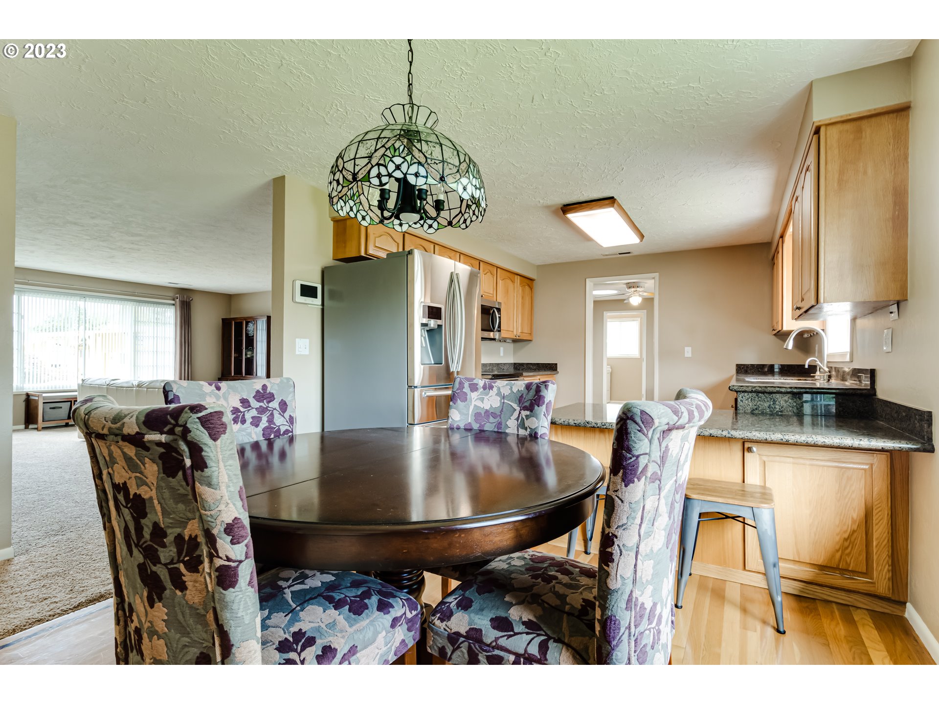 2407 17th Street Springfield, OR 97477 - Photo 16 of 40 a view of a dining room with furniture and chandelier