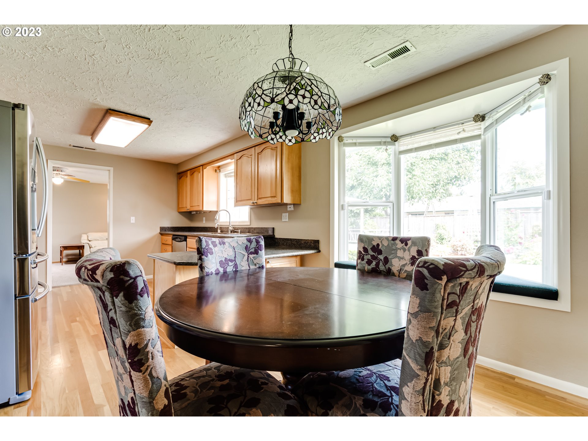 2407 17th Street Springfield, OR 97477 - Photo 22 of 40 a view of a dining room with furniture window and outside view