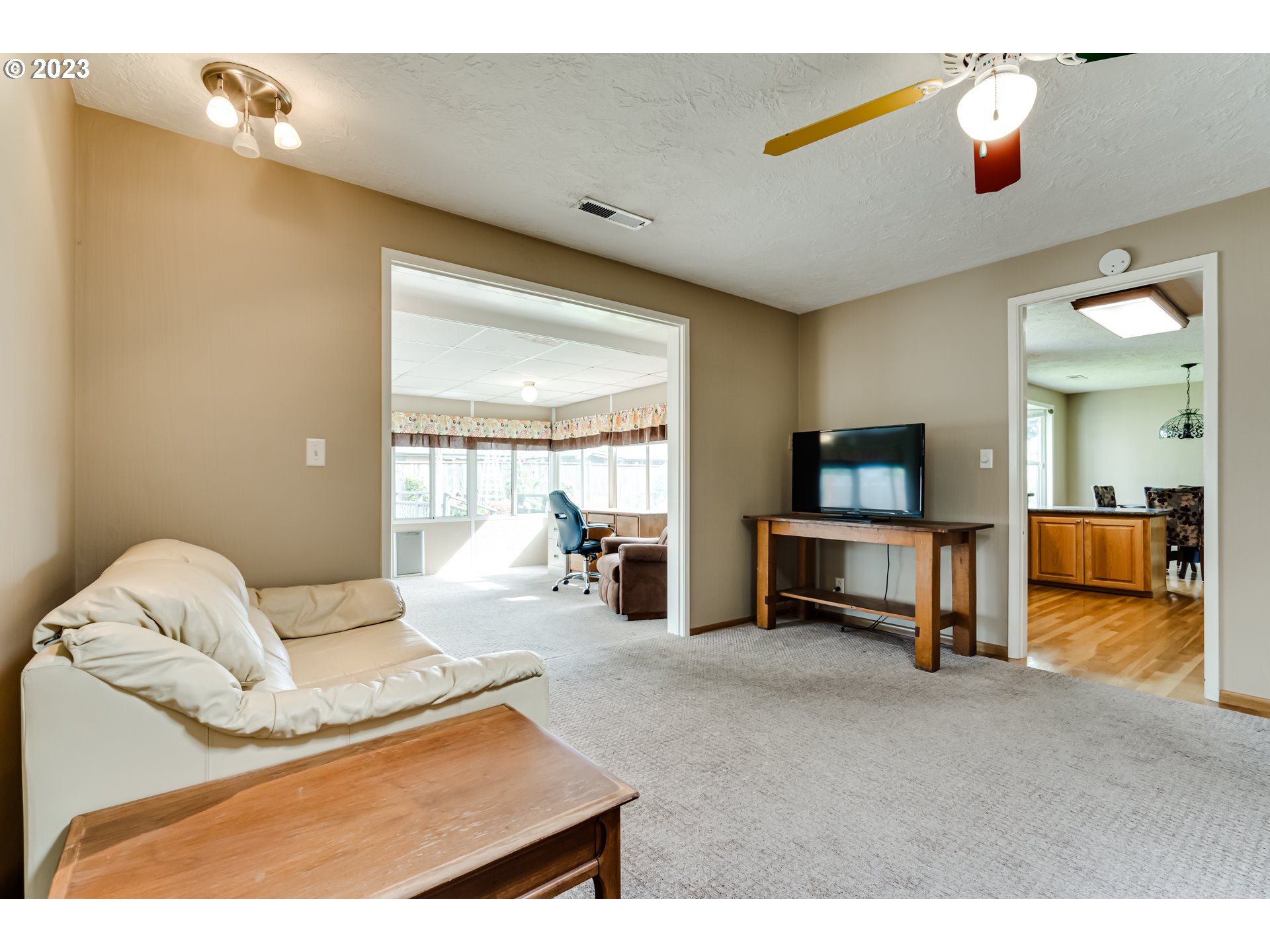 2407 17th Street Springfield, OR 97477 - Photo 23 of 40 a living room with furniture and a flat screen tv
