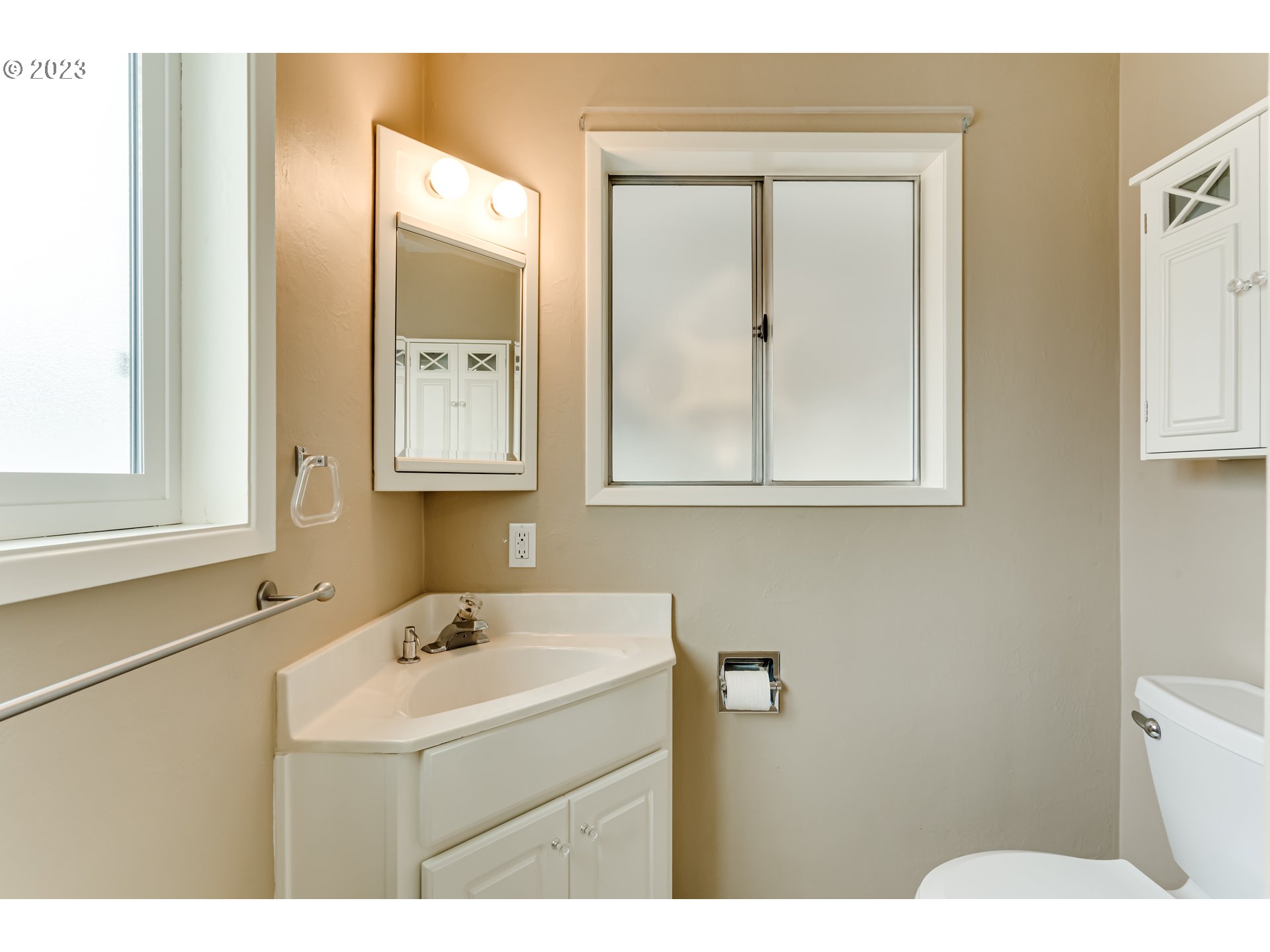 2407 17th Street Springfield, OR 97477 - Photo 29 of 40 a bathroom with a sink and a mirror