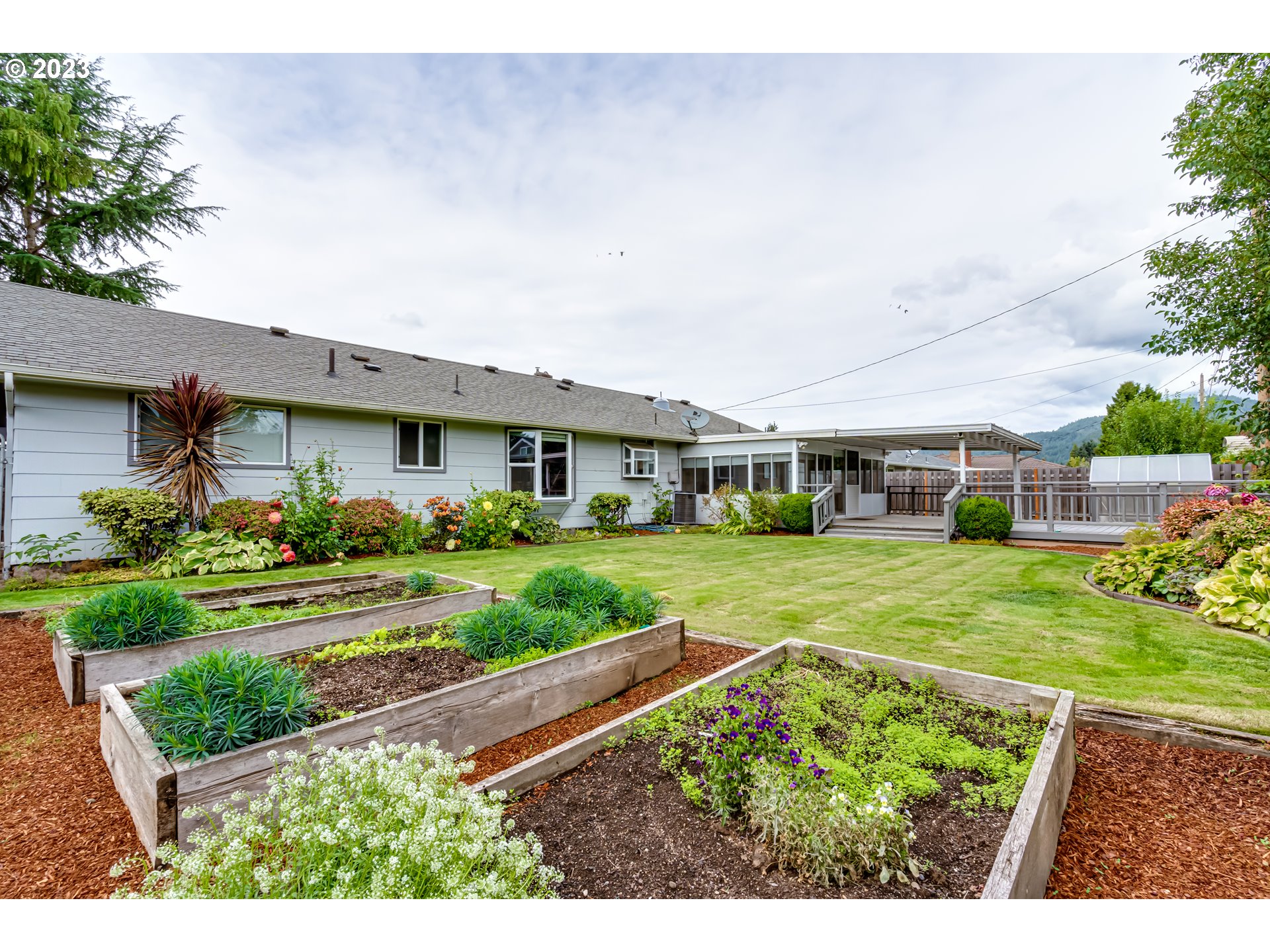 2407 17th Street Springfield, OR 97477 - Photo 37 of 40 a view of an house with backyard space and garden