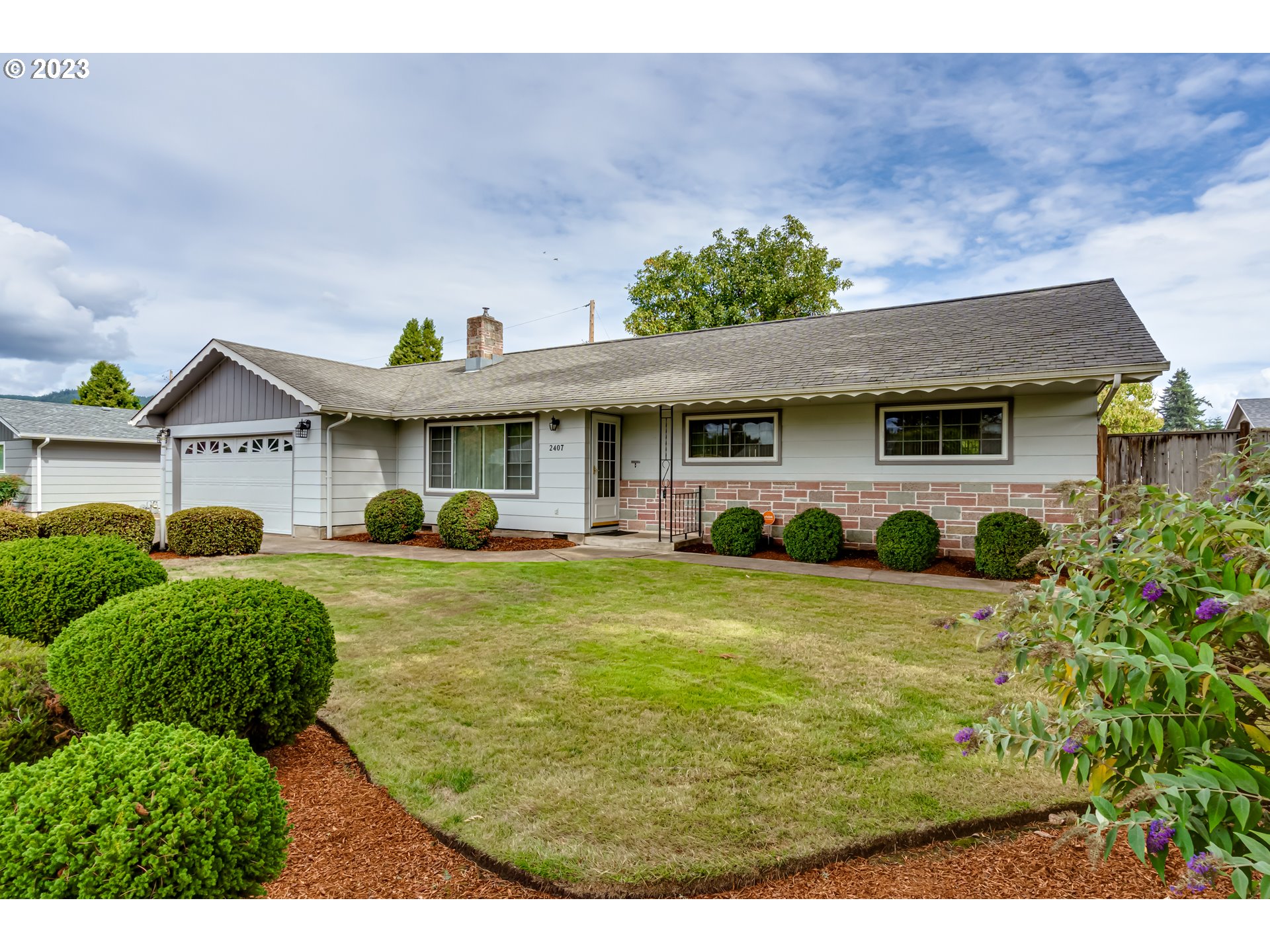 2407 17th Street Springfield, OR 97477 - Photo 39 of 40 a front view of a house with a yard