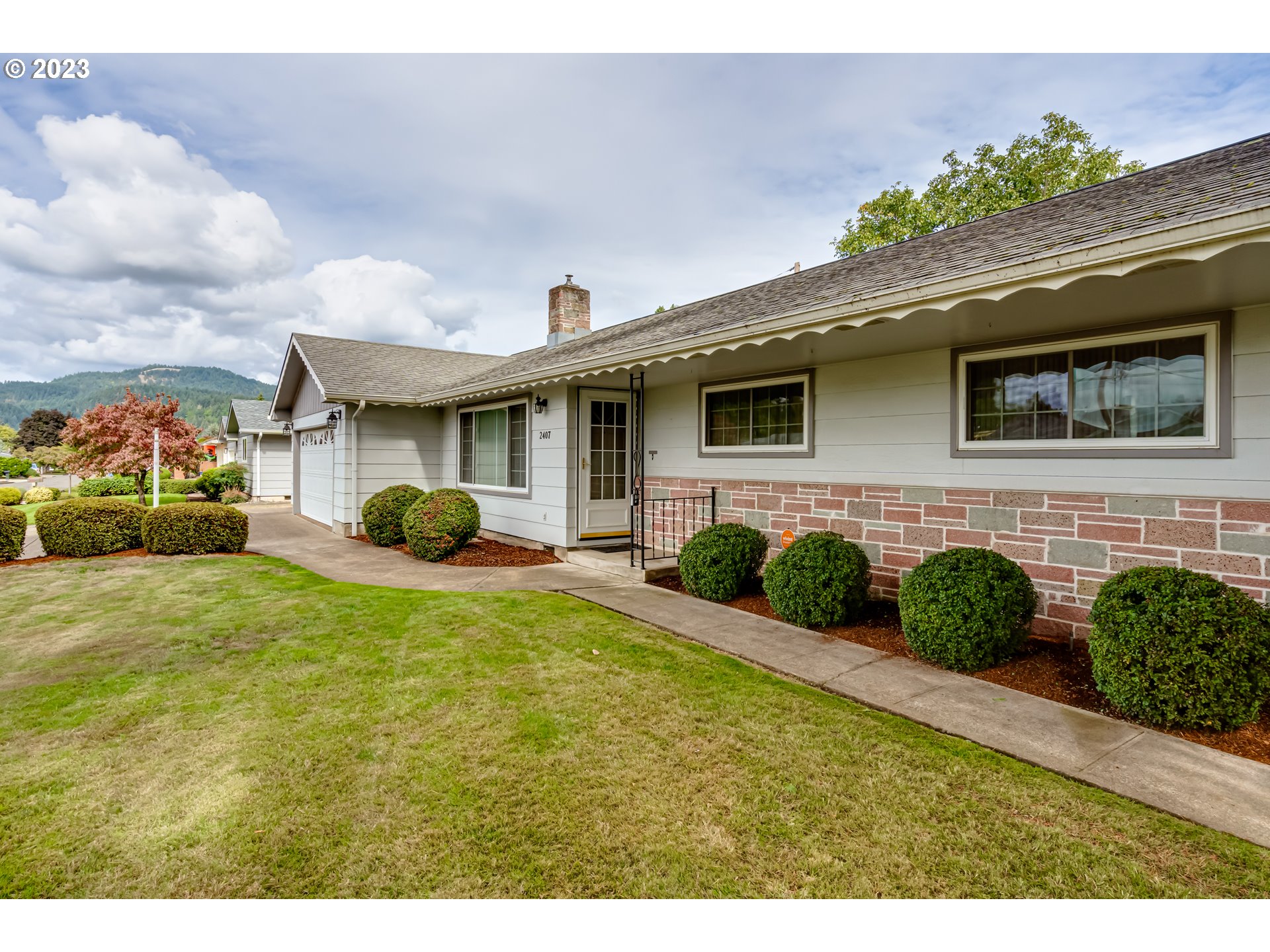 2407 17th Street Springfield, OR 97477 - Photo 40 of 40 a front view of a house with garden