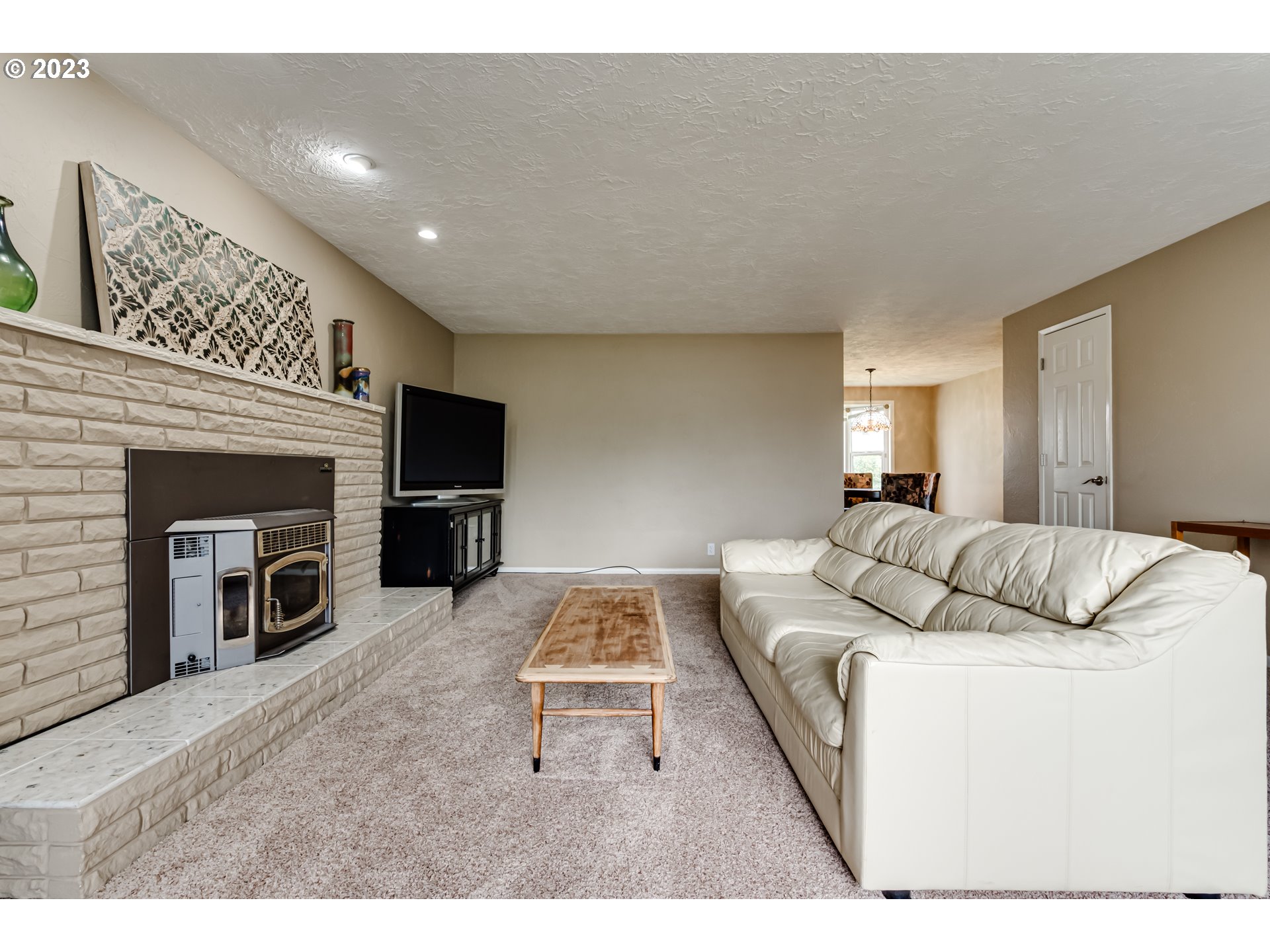 2407 17th Street Springfield, OR 97477 - Photo 6 of 40 a living room with furniture and a fireplace