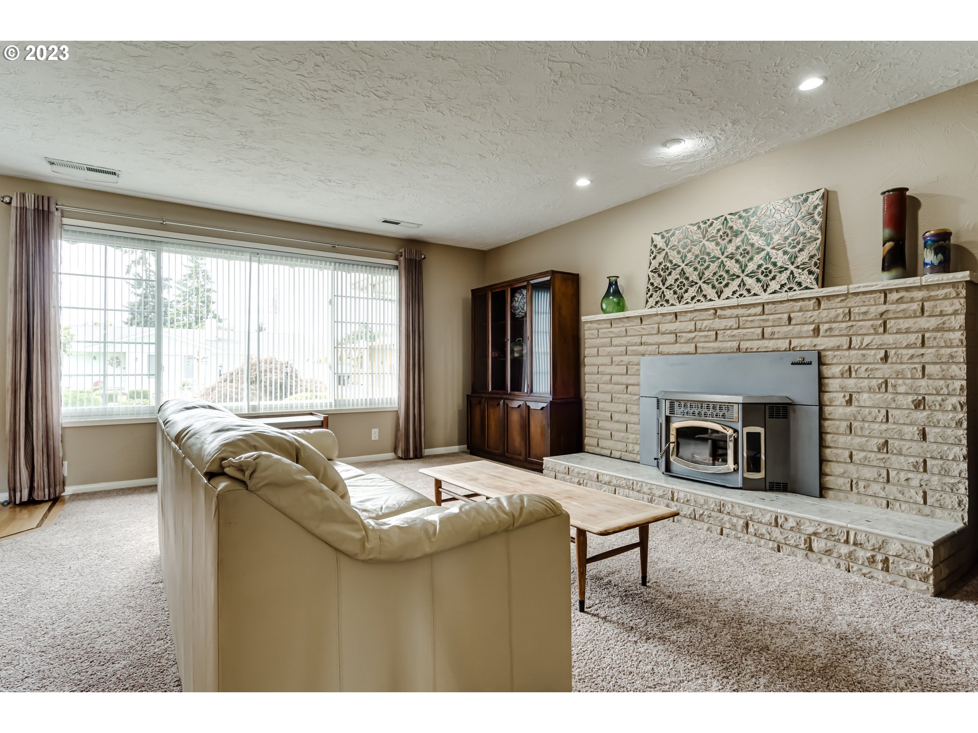 2407 17th Street Springfield, OR 97477 - Photo 7 of 40 a living room with furniture and a fireplace