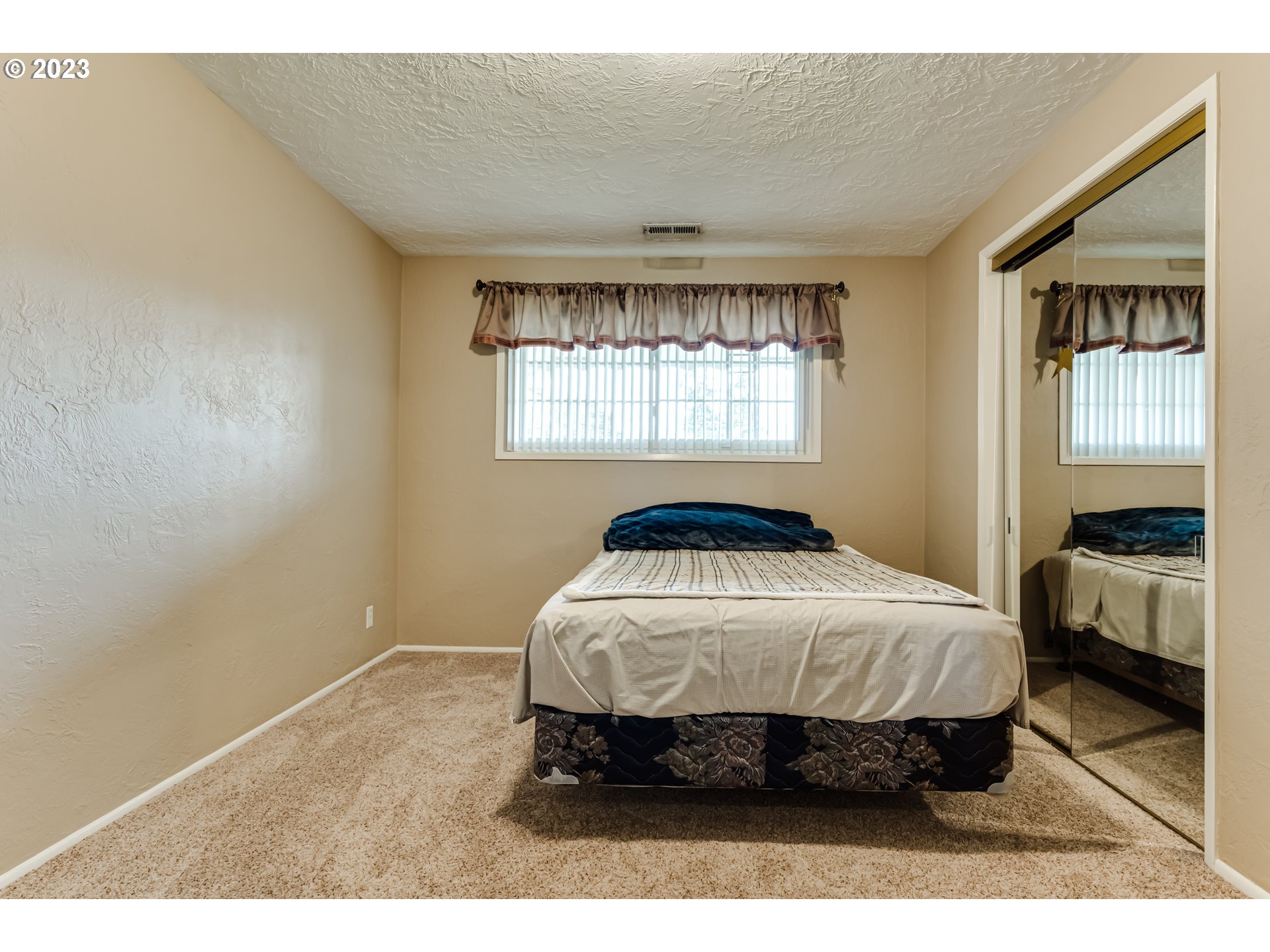 2407 17th Street Springfield, OR 97477 - Photo 9 of 40 a bedroom with a bed and window