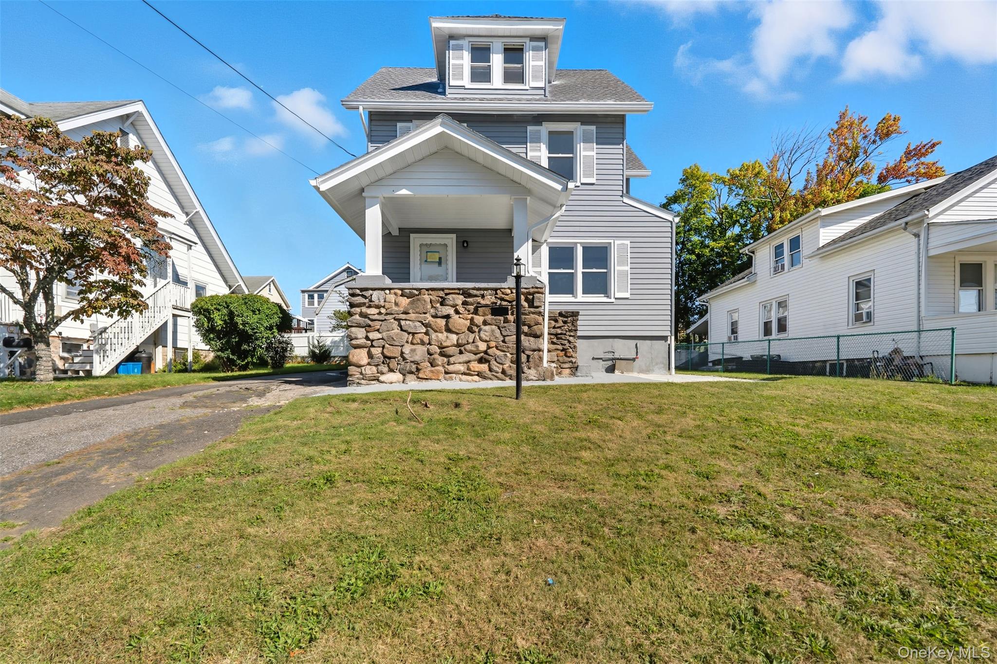 front view of a house with a yard