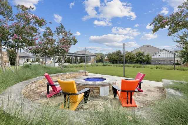 an outdoor sitting area with furniture and wooden floor
