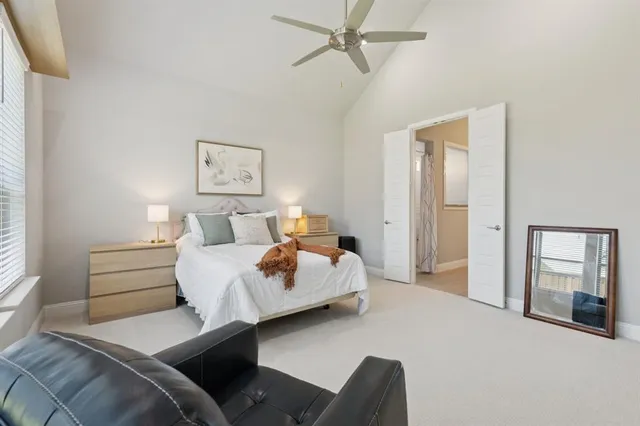 a bedroom with bed and window