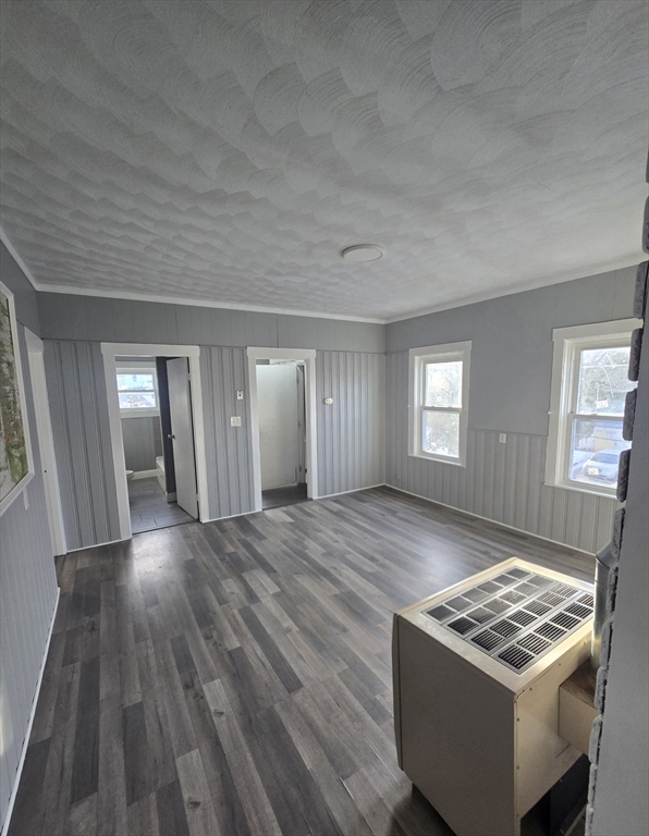 351 Tecumseh Street, Unit 2 Fall River, MA 02721 - Photo 13 of 14 a view of an empty room and window and wooden floor