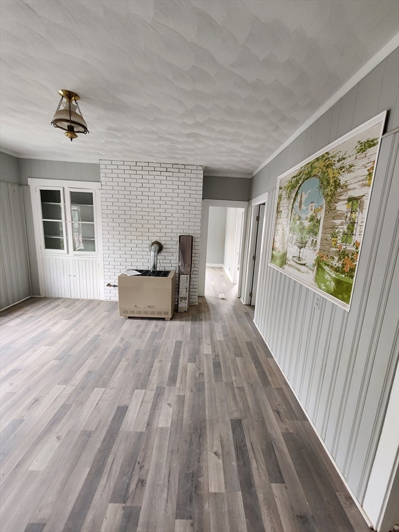 351 Tecumseh Street, Unit 2 Fall River, MA 02721 - Photo 2 of 14 a view of empty room with wooden floor and fan
