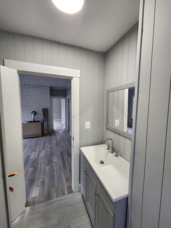 351 Tecumseh Street, Unit 2 Fall River, MA 02721 - Photo 3 of 14 a en suite bathroom with a sink and mirror