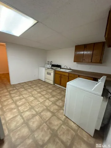 a utility room with washer and dryer