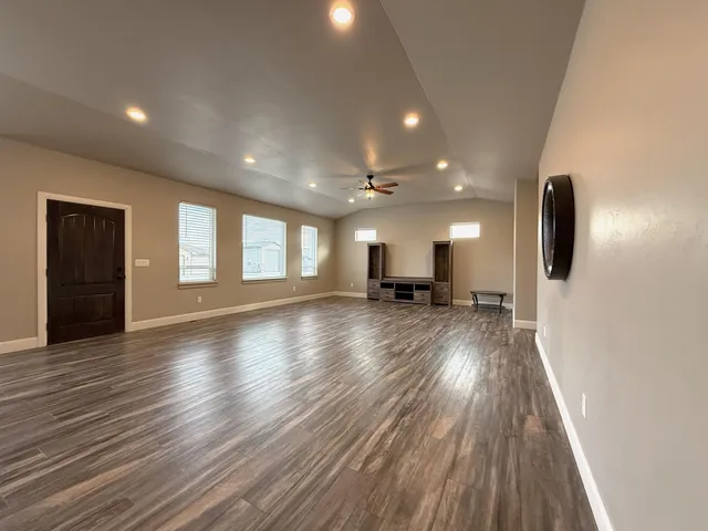 a view of a kitchen with a sink and a stove top oven