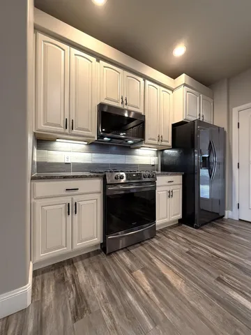 a view of a gym equipment and a flat screen tv