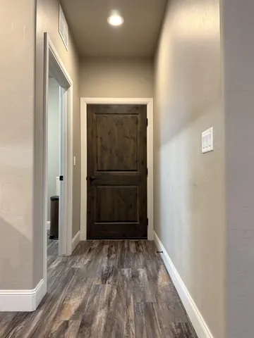 a spacious bedroom with a bed and window