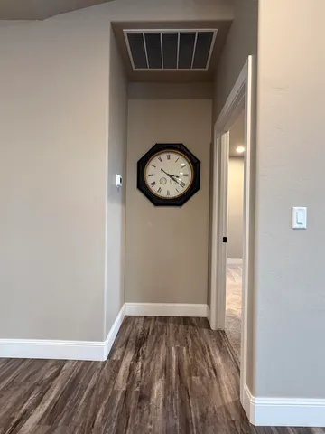 a spacious bathroom with a double vanity sink and a mirror