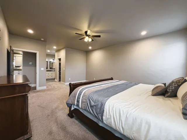 a view of a kitchen with a sink and a refrigerator