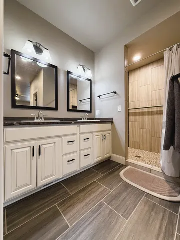 a kitchen with cabinets and window