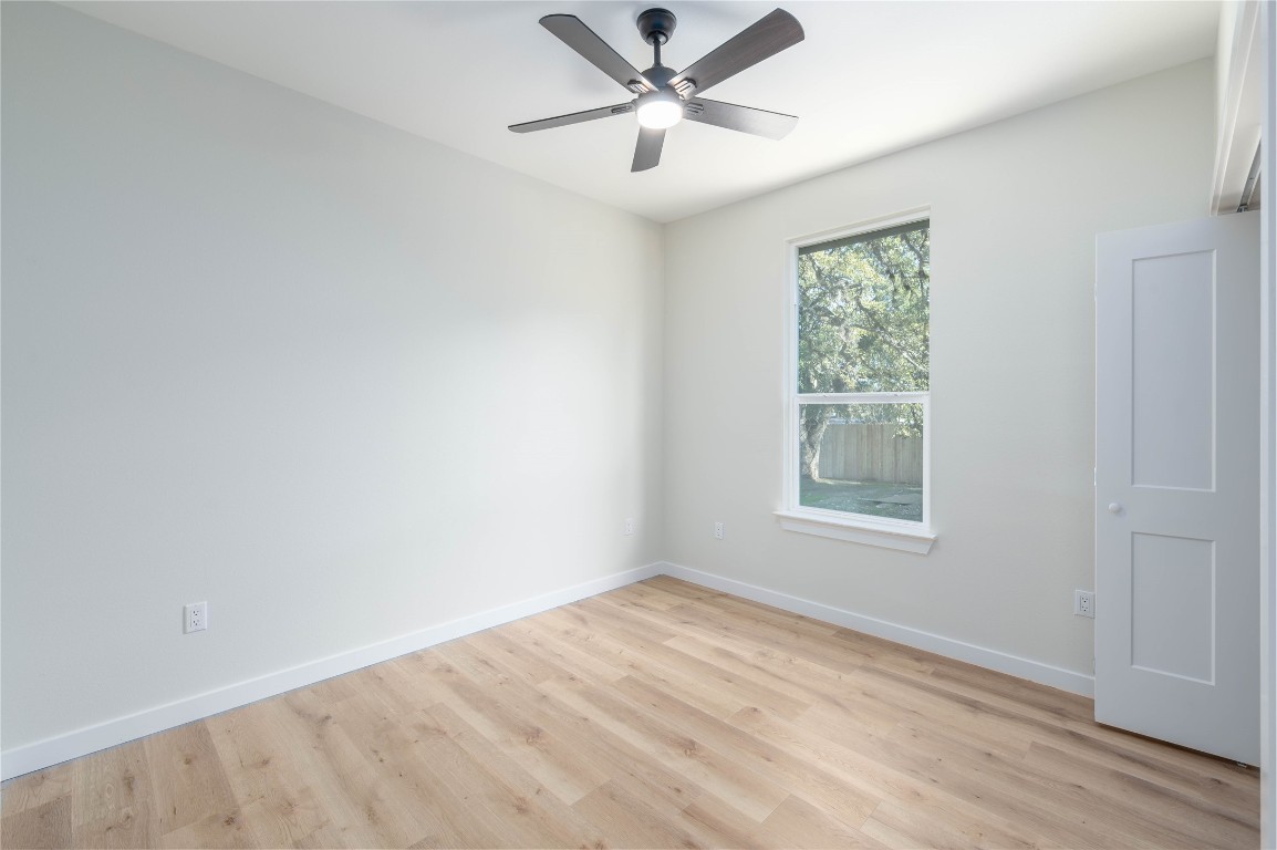 11541 Main Street Jonestown, TX 78645 - Photo 14 of 15 an empty room with a window and a fan