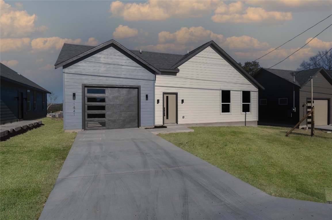 11541 Main Street Jonestown, TX 78645 - Photo 4 of 15 a view of a house with a yard