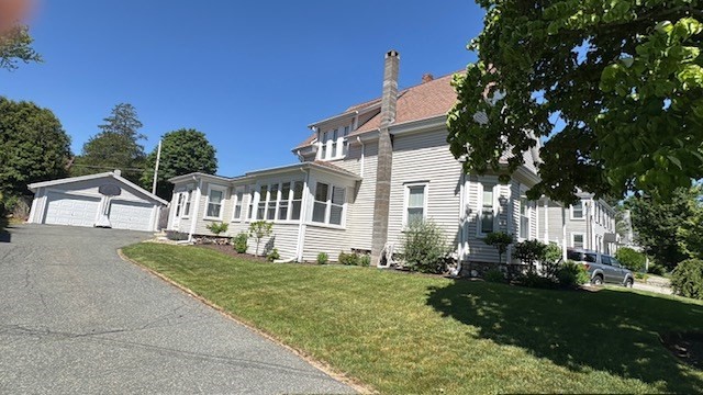 1012 Washington Street Whitman, MA 02382 - Photo 1 of 37 a front view of a house with a yard