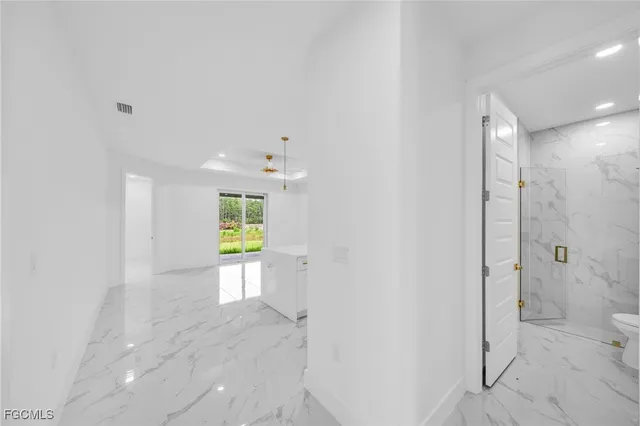 a view of a bathroom with a bathtub and shower